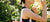 Women spending time in a rose garden and taking a moment to smell the roses.