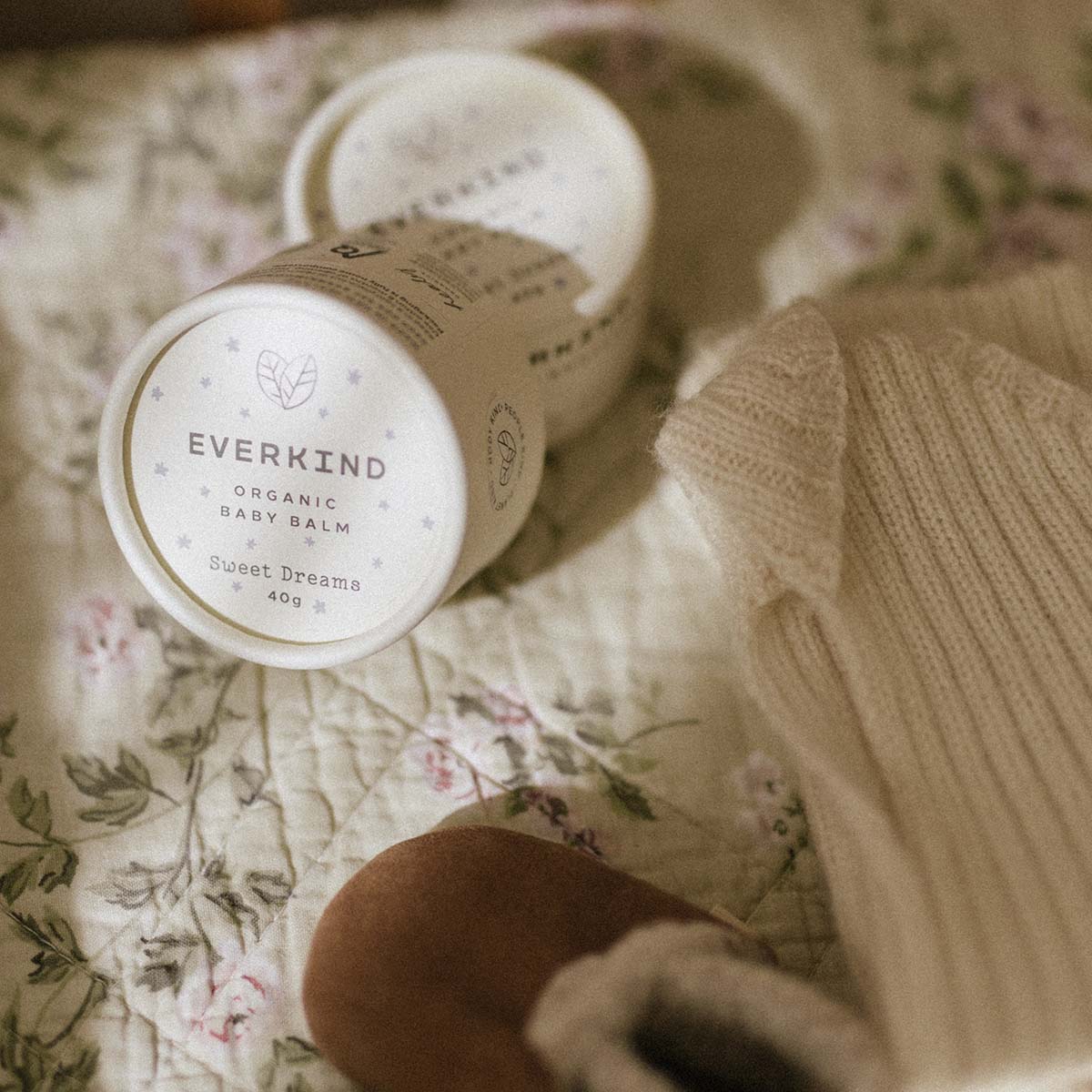 Eco conscious mother getting baby's nursery ready with skin care and clothing that's all natural.