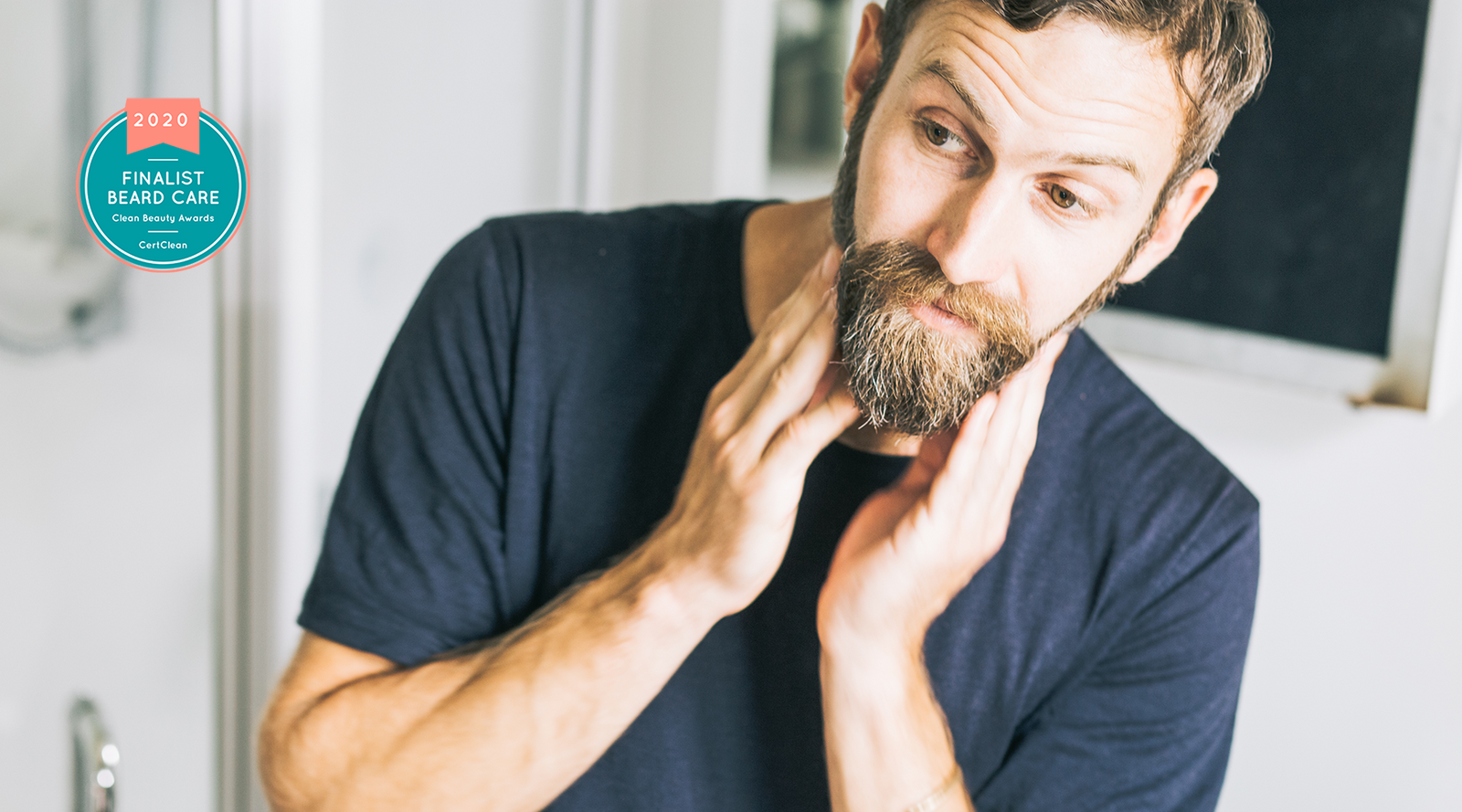 Man using Everkind organic beard balm to groom his modern beard. No nasties, cruelty-free and forever recyclable packaging.