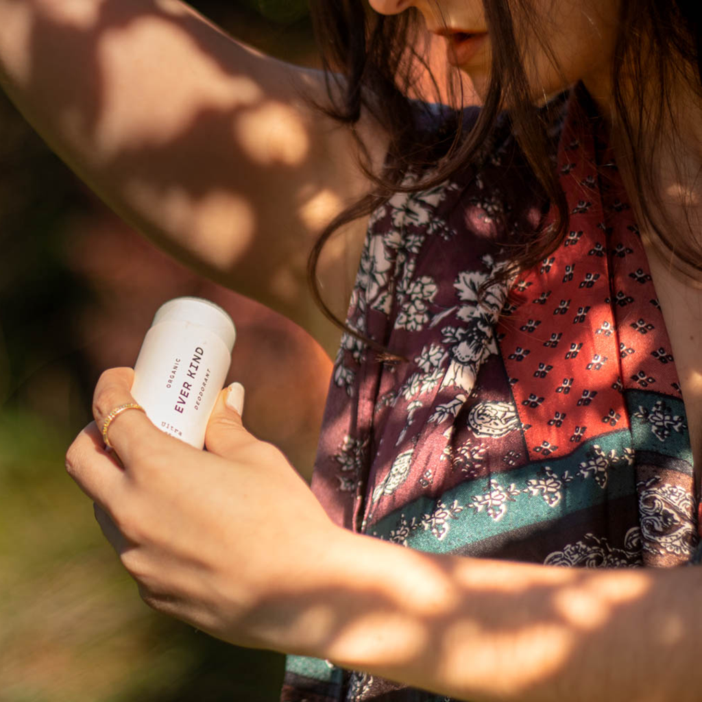 Woman applying Everkind Organic Natural Deodorant. It glides on summer and winter, is trusted by athletes and gentle for sensitive skin. 